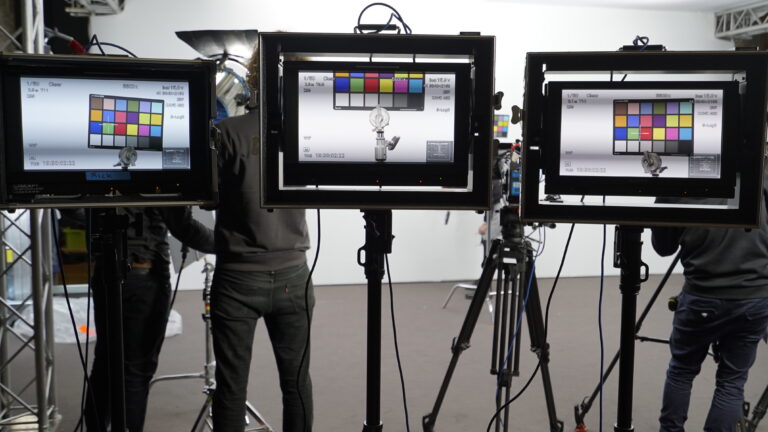 Three video monitors displaying colour calibration charts in a professional video production studio. The shoot used 3 Sony cameras, two FX6's & an FX9