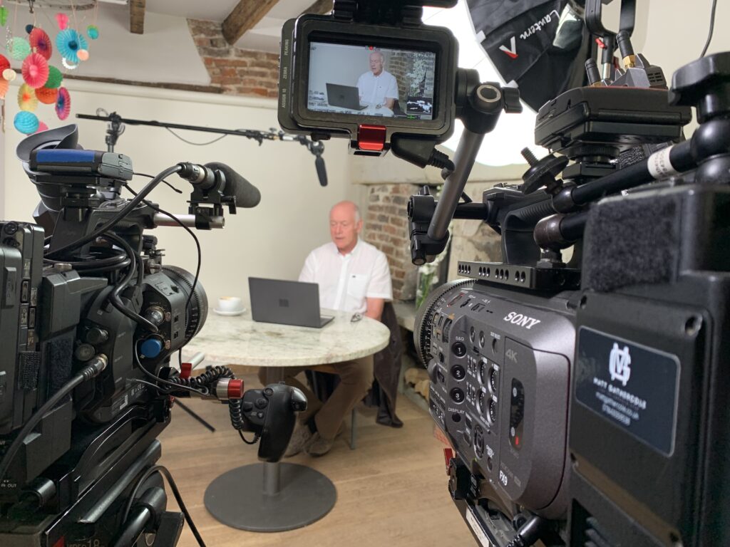 2 Sony cameras, an FX6 & FX9 with Canon cine prime lenses as part of a TV interview setup. The scene is lit by Aputure Professional Lighting equipment.